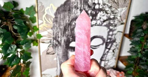 Rose Quartz tower held in hand, used for anxiety relief and emotional healing.