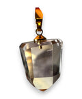 Faceted Citrine crystal pendant with gold accent on a white background