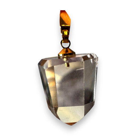 Faceted Citrine crystal pendant with gold accent on a white background