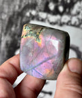 Pink Labradorite freeform with purple fractures, orange glow, and gold-green shimmer – Crystals & Reiki.